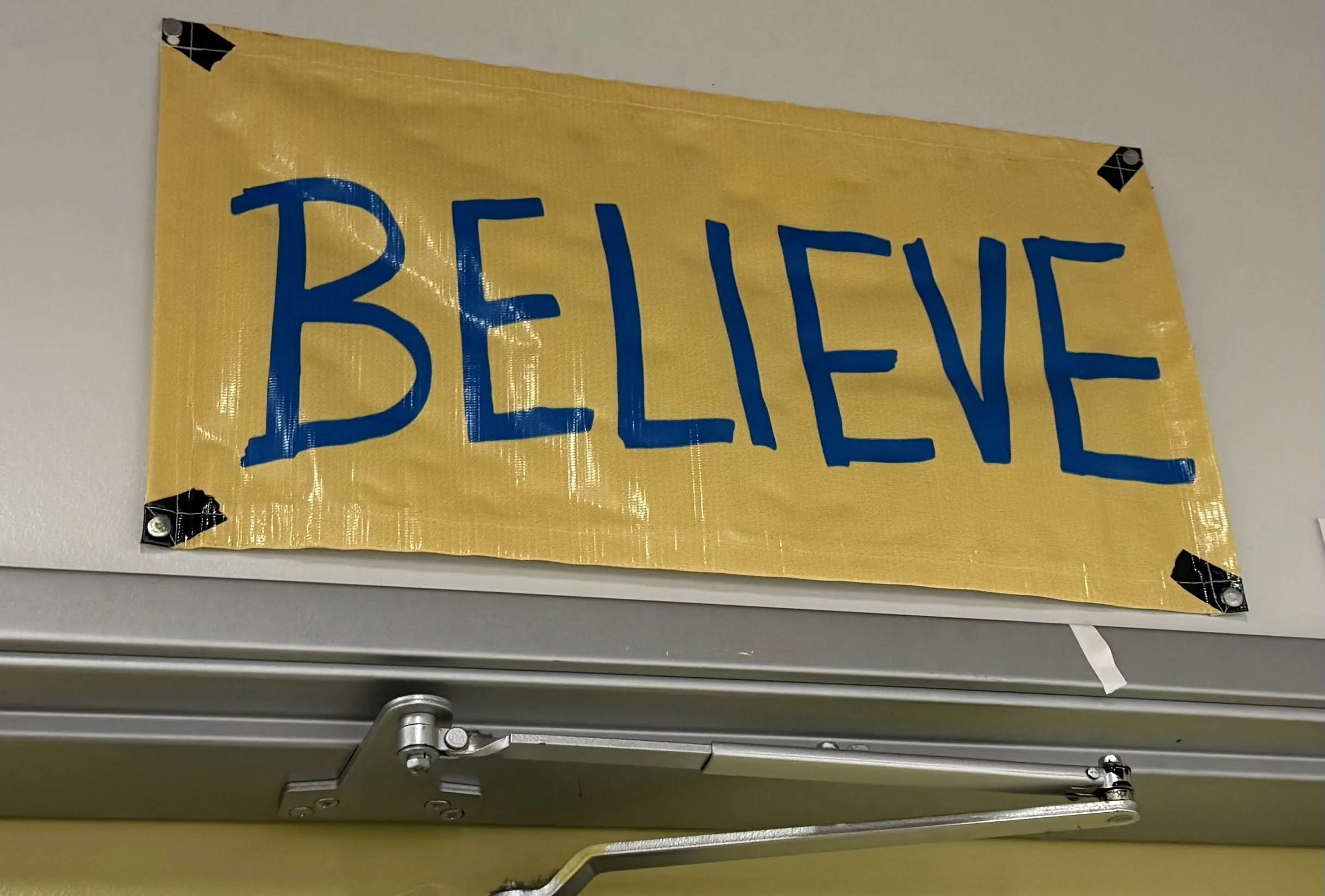 A 'Believe' sign in Dan McCauley's classroom